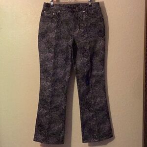 NWOT Express Stretch Jeans unique lace pattern in black on gray background. Size